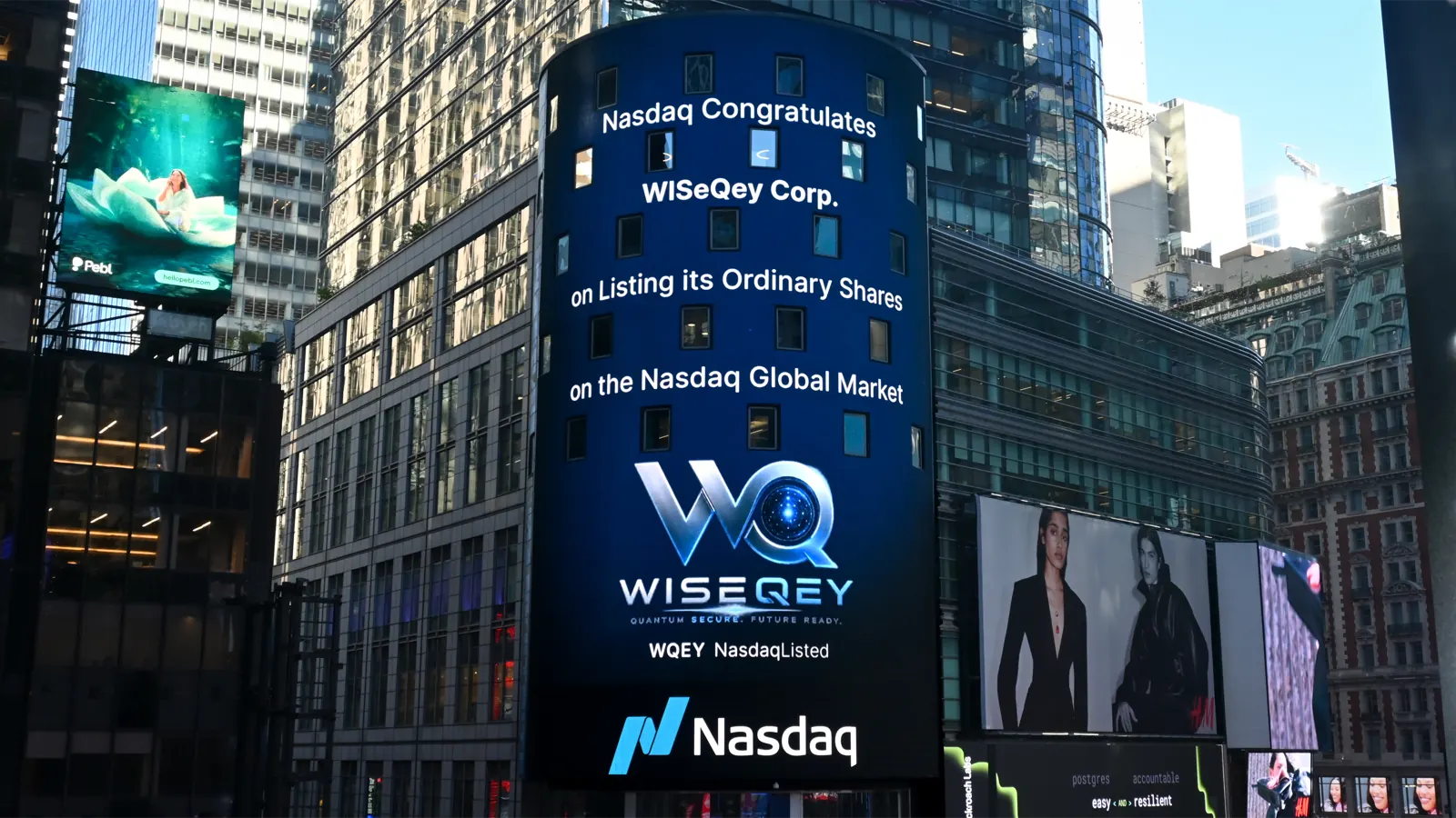 The Nasdaq Tower in Times Square reading "Nasdaq congratulates WISeQey Corp. on listing its ordinary shares on the Nasdaq Global Market".